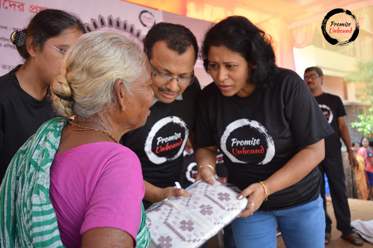 Gifting saree to an old lady