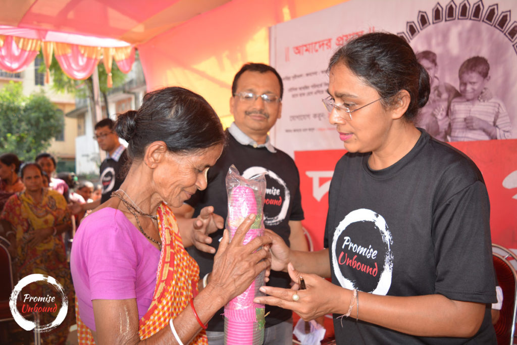 Handing over saree to a lady